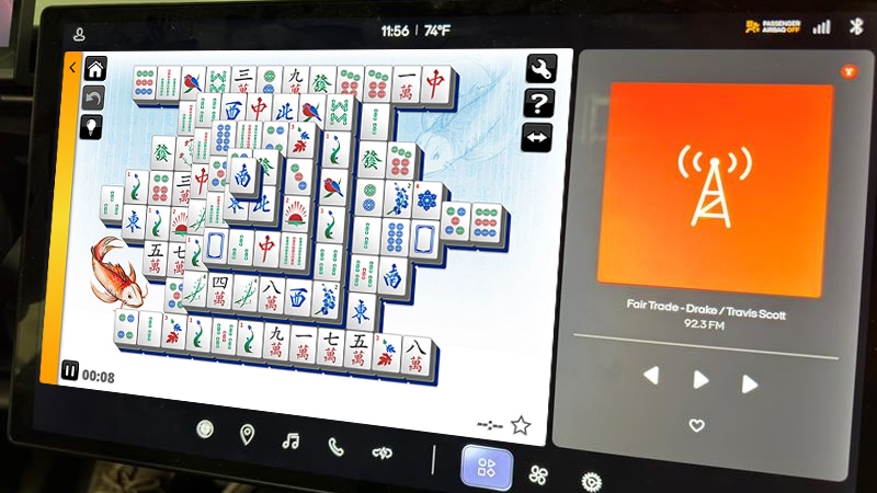 playing 247 games mahjong on an airplane headrest